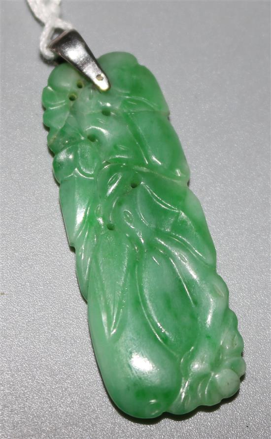 A carved jadeite pendant, 2in.